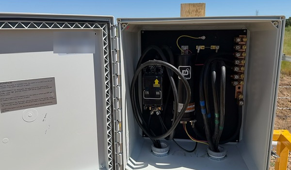 Open enclosure showing a DC decoupler and copper bus bars with cables landed